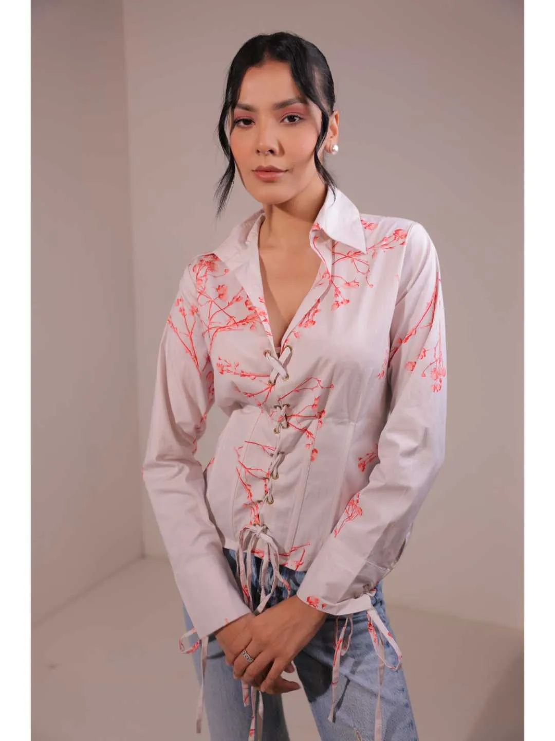 modish cotton lycra floral printed shirt collar corset with front rivets tie-up , full cuff sleeve top . -Off White